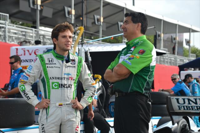 Carlos Munoz talks with a crew member before Qualifying. -- Photo by: Chris Owens