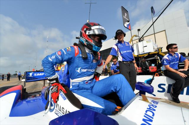 Mikhail Aleshin climbs in his car for Qualifying. -- Photo by: Chris Owens