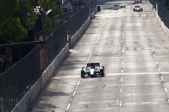 Simon Pagenaud takes the twin checkers and wins the 2013 Grand Prix of Baltimore -- Photo by: Bret Kelley