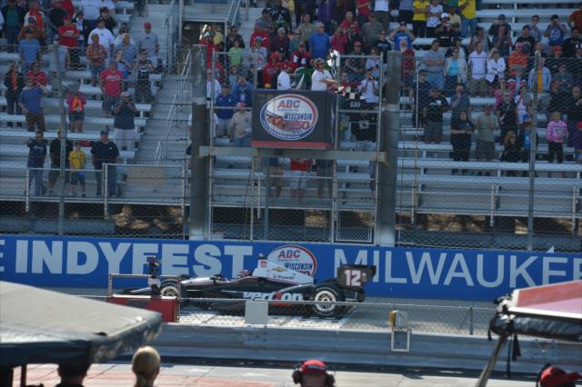Will Power takes the twin checkered flags to win the ABC Supply Wisconsin 250 at the Milwaukee Mile -- Photo by: Chris Owens