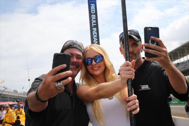 Fans with a grid girl prior to the Angie's List Grand Prix of Indianapolis -- Photo by: Chris Jones