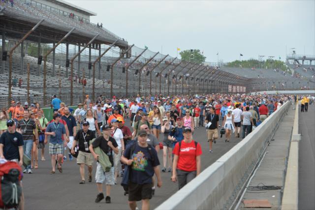 Fans enjoy walking the frontstretch during the track invasion following the Angie's List Grand Prix of Indianapolis at the Indianapolis Motor Speedway -- Photo by: Chris Owens