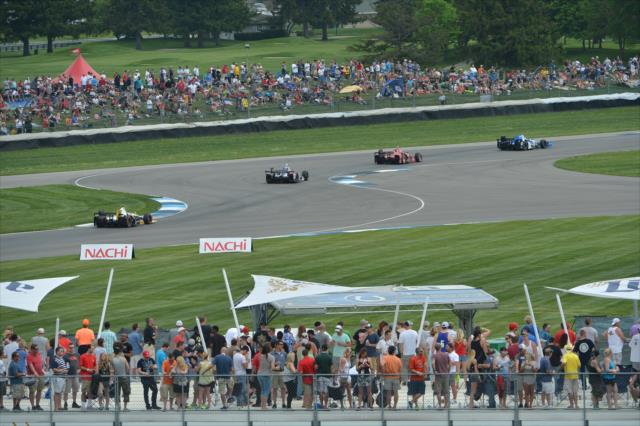 The field streams through the Turn 5-6 kink during the Angie's List Grand Prix of Indianapolis at the Indianapolis Motor Speedway -- Photo by: Chris Owens
