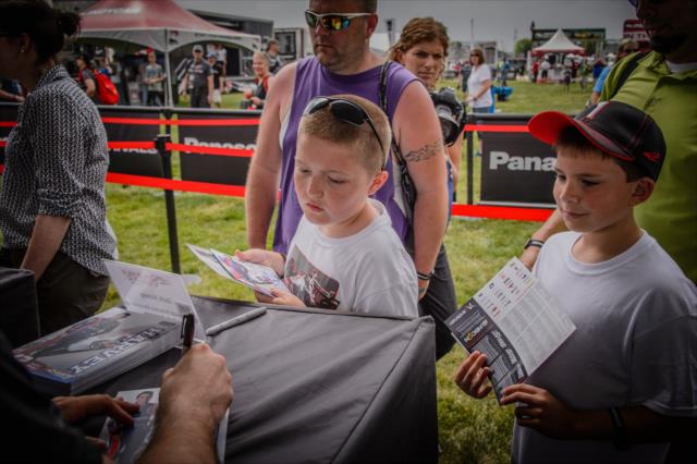 Fans line up for the autograph session at IMS -- Photo by: Forrest Mellott
