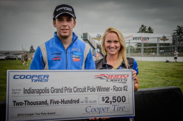 Ed Jones receives a check for achieving pole for the Indy Lights race at IMS -- Photo by: Forrest Mellott