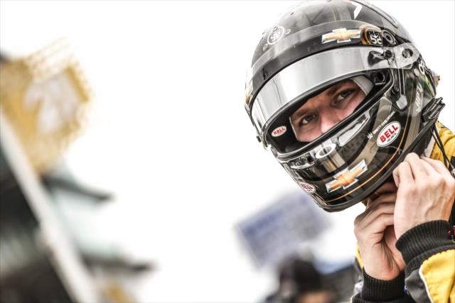 Josef Newgarden straps on his helmet prior to the Angie's List Grand Prix of Indianapolis at the Indianapolis Motor Speedway -- Photo by: Shawn Gritzmacher