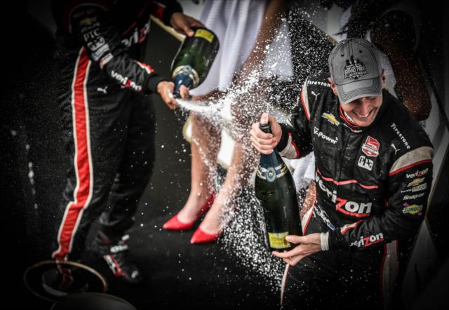 The champagne flies on Victory Lane toward the victor, Will Power -- Photo by: Shawn Gritzmacher