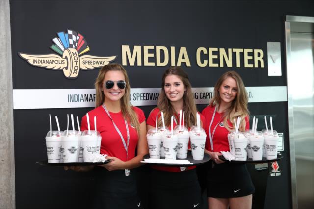 Steak n Shake Paddock Girls deliver milk shakes to the IMS Media Center -- Photo by: Chris Jones