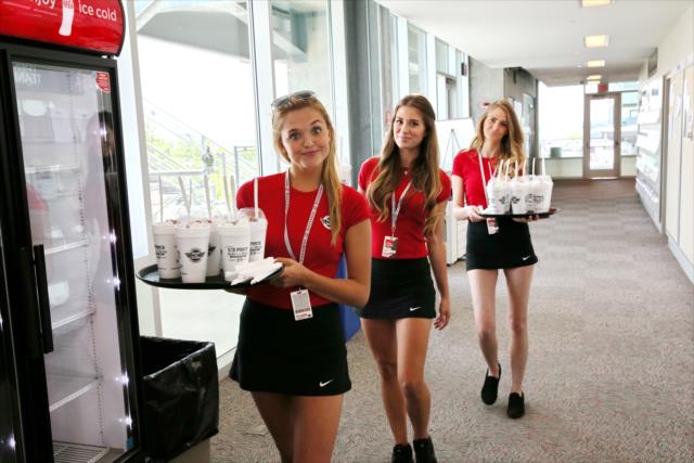 Steak n Shake Paddock Girls deliver milk shakes to the IMS Media Center -- Photo by: Chris Jones