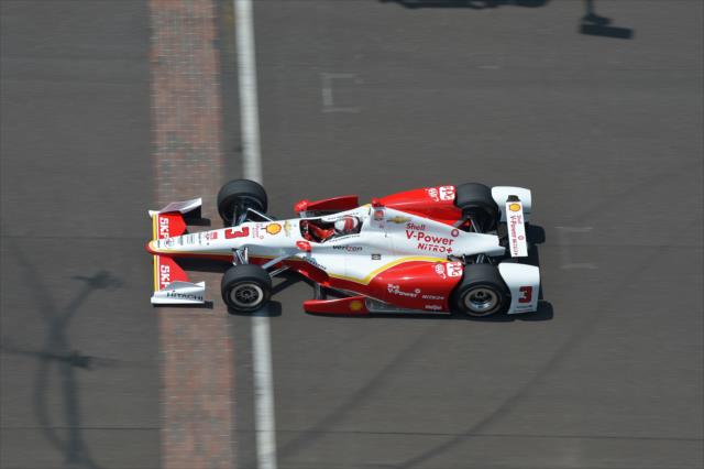 Helio Castroneves crosses the yard of bricks -- Photo by: Chris Owens