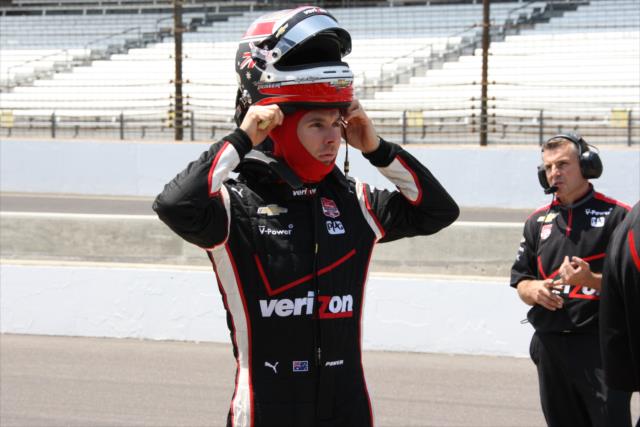 Will Power straps on his helmet prior to practice for the Indianapolis 50 at the Indianapolis Motor Speedway -- Photo by: Leigh Spargur