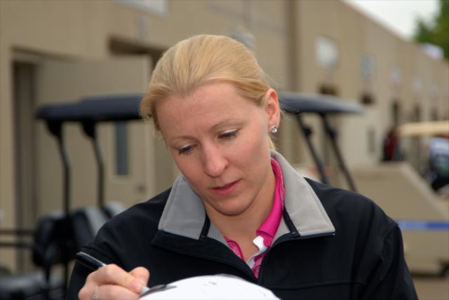 Pippa Mann signs an autograph for a fan at IMS -- Photo by: Mike Young