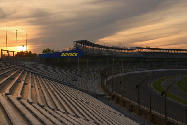The sun sets over Turn 1 at the Indianapolis Motor Speedway -- Photo by: Walter Kuhn