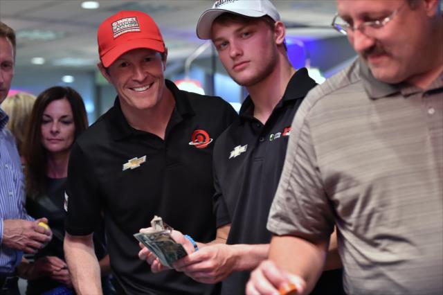 Scott Dixon and Sage Karam watch the action at the annual casino night at the Indianapolis Motor Speedway -- Photo by: Chris Owens
