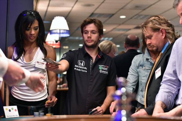 Carlos Munoz cashes in at the annual casino night at the Indianapolis Motor Speedway -- Photo by: Chris Owens