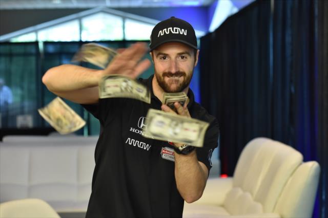 James Hinchcliffe making it rain at the annual casino night at the Indianapolis Motor Speedway -- Photo by: Chris Owens