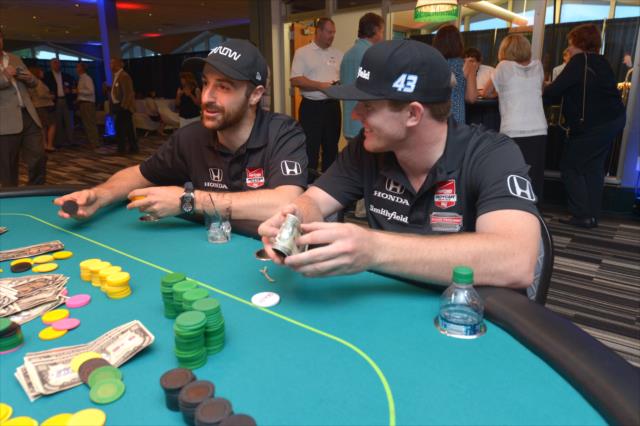 James Hinchcliffe and Conor Daly make a few wagers at the annual casino night at the Indianapolis Motor Speedway -- Photo by: Chris Owens