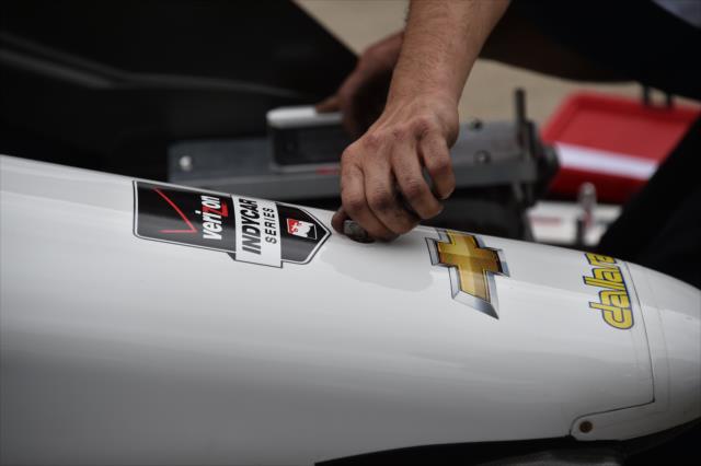 Engineer adjusts a front wing on a Verizon IndyCar Series car -- Photo by: Dana Garrett