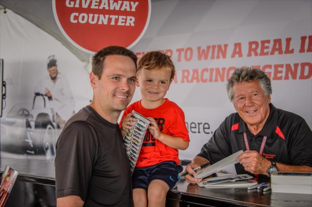 Family gets a picture with Mario Andretti at IMS -- Photo by: Forrest Mellott