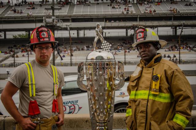 Firemen stand with the Borg-Warner Trophy -- Photo by: Forrest Mellott