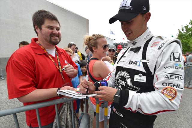Graham Rahal signs autographs for fans -- Photo by: John Cote