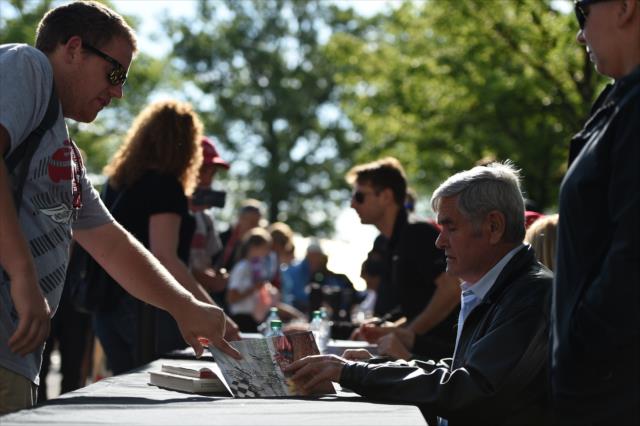 Al Unser signs an autograph during the autograph session on Legends Day at the Indianapolis Motor Speedway -- Photo by: Eric Anderson