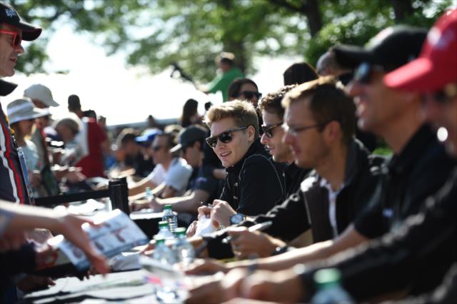 Josef Newgarden and the 99th Indy 500 field sign autographs during the autograph session on Legends Day at the Indianapolis Motor Speedway -- Photo by: Eric Anderson