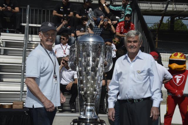 Parnelli Jones and Al Unser pose with the Borg-Warner Trophy during the public drivers meeting at the Indianapolis Motor Speedway -- Photo by: Jim Haines