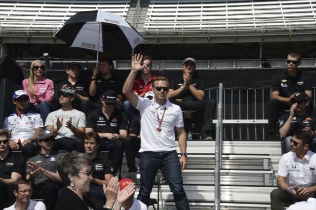 Ed Carpenter waives to the crowd during the public drivers meeting at the Indianapolis Motor Speedway -- Photo by: Jim Haines