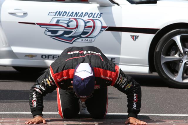 Juan Pablo Montoya kisses bricks after winning Indy 500 -- Photo by: Chris Jones