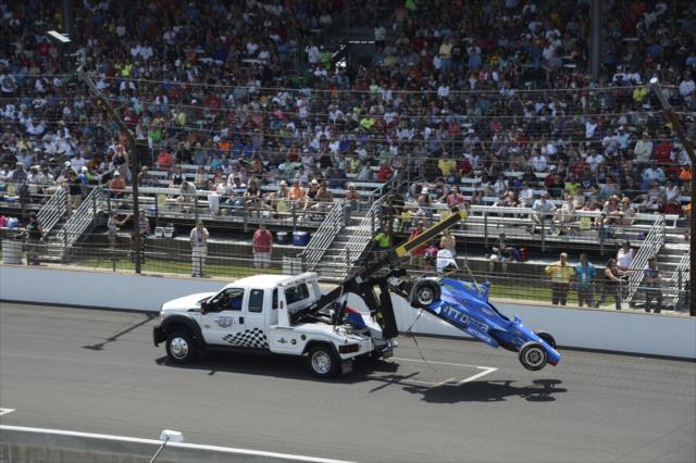 Tow truck lifts Tony Kanaan's car after it crashed during the Indianapolis 500 -- Photo by: Jim Haines