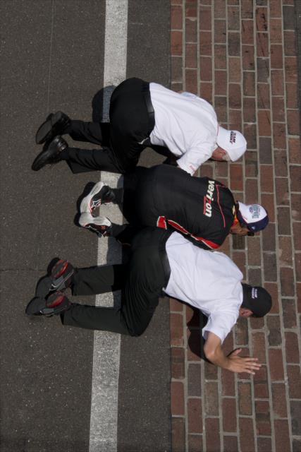 Juan Pablo Montoya kisses the bricks after winning the Indy 500 -- Photo by: Walter Kuhn