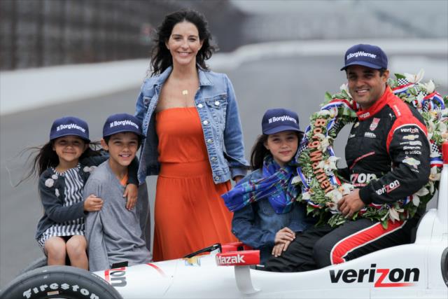 Juan Pablo Montoya wins 99th running of the Indy 500 at the Indianapolis Motor Speedway with familt in Borg-Warner hats -- Photo by: Joe Skibinski