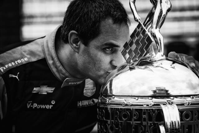 Juan Pablo Montoya kisses Borg-Warner Trophy -- Photo by: Shawn Gritzmacher