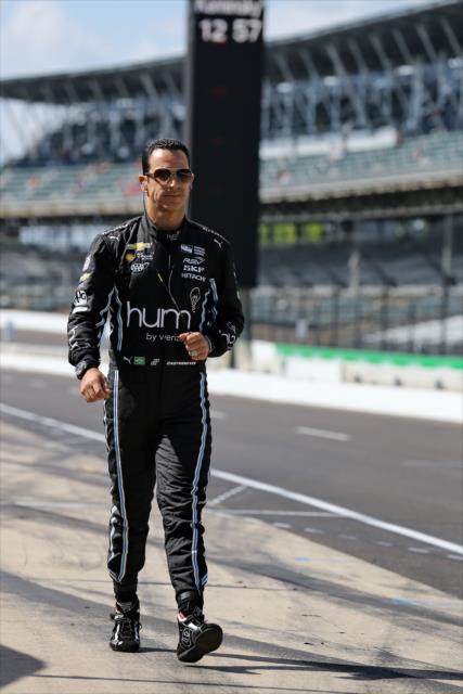 Helio Castroneves walks down pit lane at IMS -- Photo by: Chris Jones