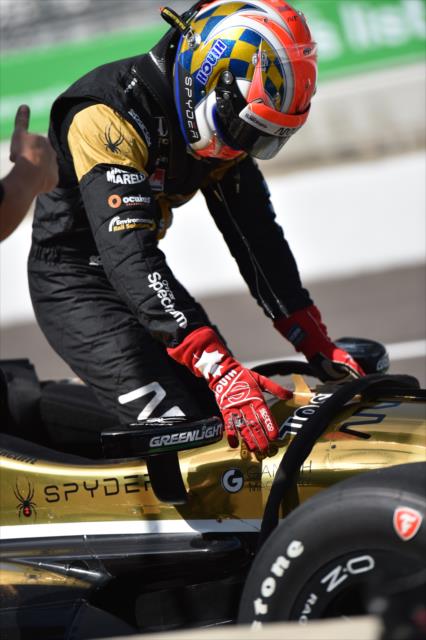 James Hinchcliffe climbs into his car for practice at IMS -- Photo by: Eric Anderson