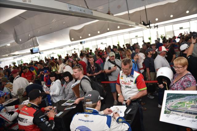 Fans gather during a Verizon IndyCar Series autograph session at the Angie's List Grand Prix of Indianapolis -- Photo by: Eric Anderson