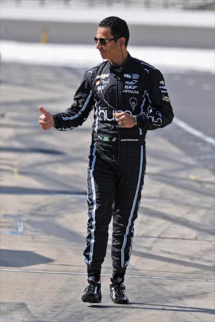 Helio Castroneves walks pit lane prior to practice for the Angie's List Grand Prix of Indianapolis -- Photo by: Walter Kuhn