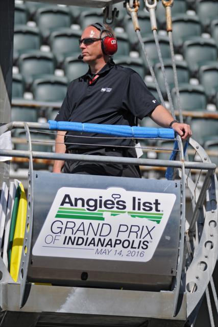 Flagman Tom Hansing watches track action during practice for the Angie's List Grand Prix of Indianapolis -- Photo by: Walter Kuhn