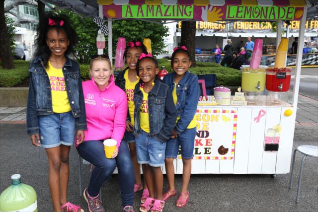 Young entrepreneurs with the help of Pippa Mann sell lemonade on Lemonade Day at the Brickyard -- Photo by: Chris Jones