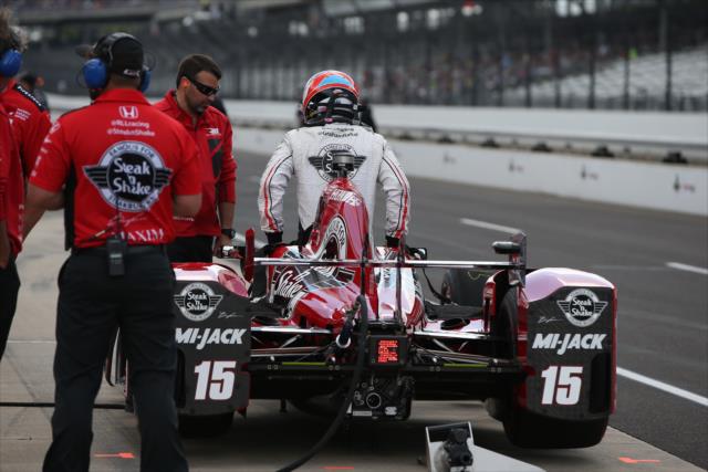 Graham Rahal climbs into his car during practice for the 100th Running of the Indy 500 presented by PennGrade Motor Oil -- Photo by: Chris Jones