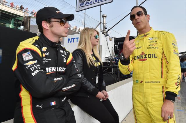 Teammates Helio Castroneves and Simon Pagenaud chat on pit lane during the Opening Day of Qualifications for the 100th Indianapolis 500 -- Photo by: Chris Owens