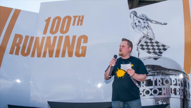 100th Running Poetry Contest Winner Adam Henze recites his poem on Victory Podium at IMS -- Photo by: Mike Finnegan