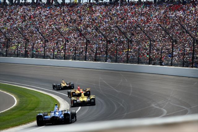 James Hinchcliffe leads the field into Turn 1 during the 100th Indianapolis 500 -- Photo by: Bret Kelley