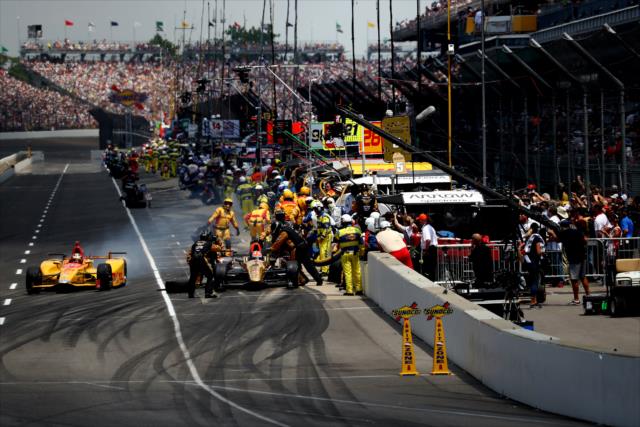 Pit lane comes to life during green flag stops during the 100th Indianapolis 500 -- Photo by: Bret Kelley