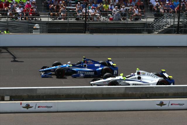 Teammates Josef Newgarden and JR Hildebrand go side-by-side down the fronstretch during the 100th Indianapolis 500 -- Photo by: Bret Kelley
