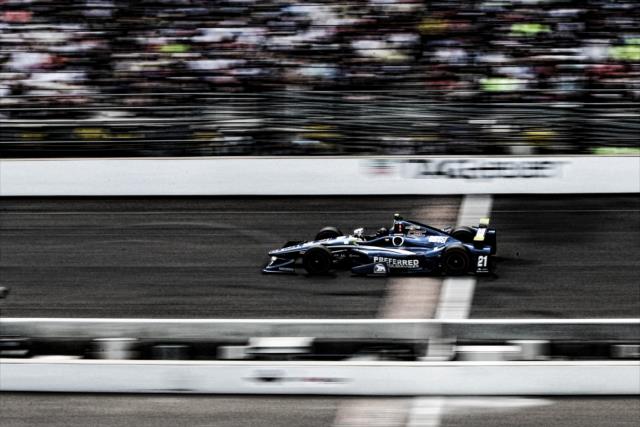 Josef Newgarden flashes across the Yard of Bricks during the 100th Indianapolis 500 -- Photo by: Bret Kelley
