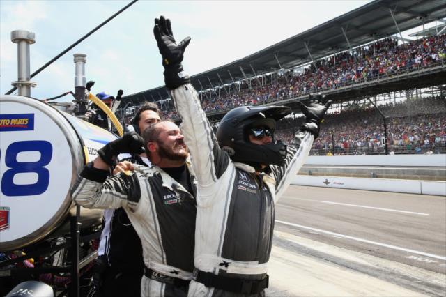 The Andretti Herta Autosport team begins the celebration as Alexander Rossi wins the 100th Indianapolis 500 -- Photo by: Chris Jones