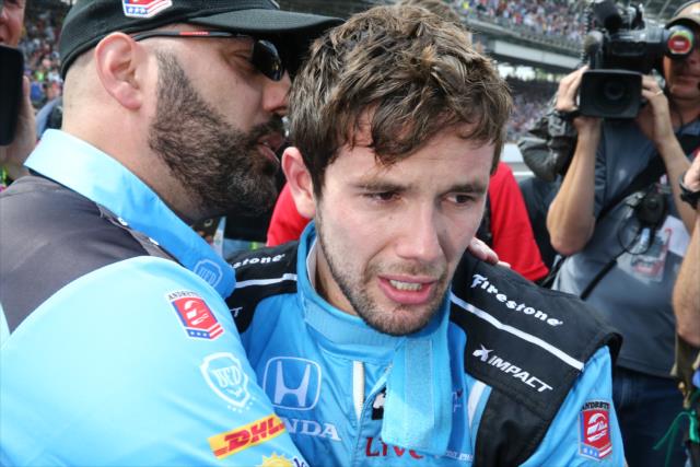 A dejected Carlos Munoz on pit lane following his runner-up finish in the 100th Indianapolis 500 -- Photo by: Chris Jones