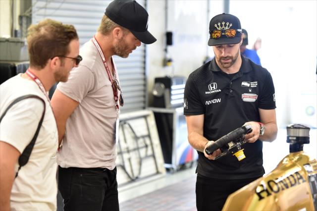 James Hinchcliffe shows Honorary Starter Chris Pine the ins and outs of a Verizon IndyCar Series car -- Photo by: Chris Owens